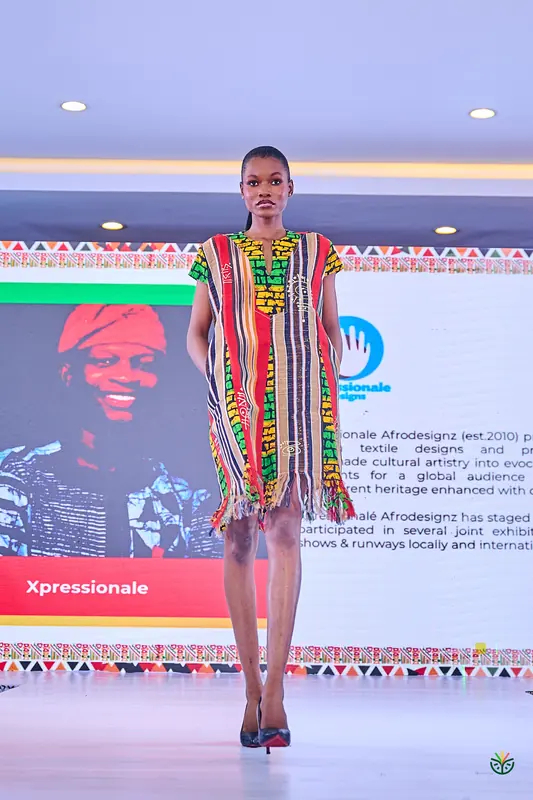An Xpressionale design in bold stripes on the runway