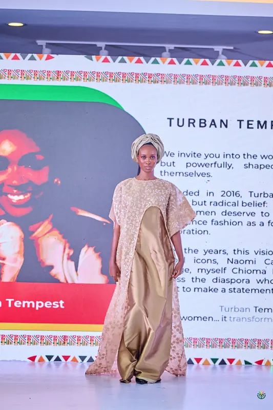 A gold and cream Turban Tempest look on the runway