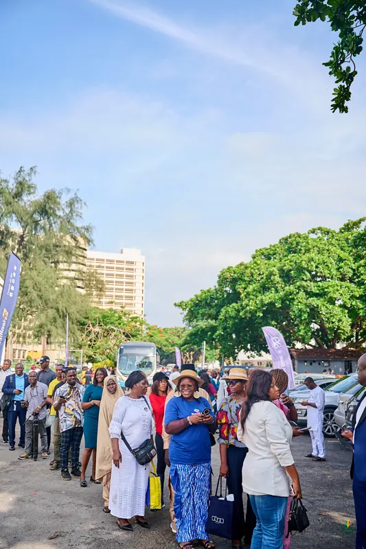 Attendees queue outside Federal Palace on the morning of Day 2