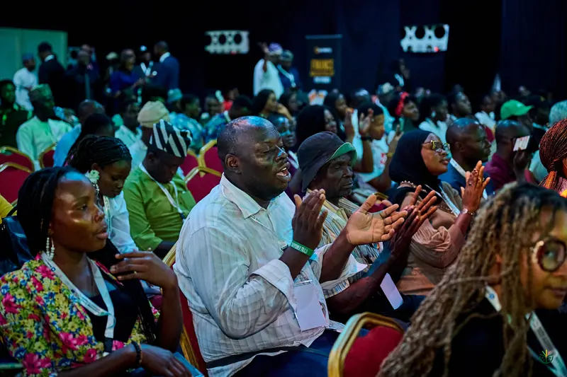 The audience applauds during the morning session