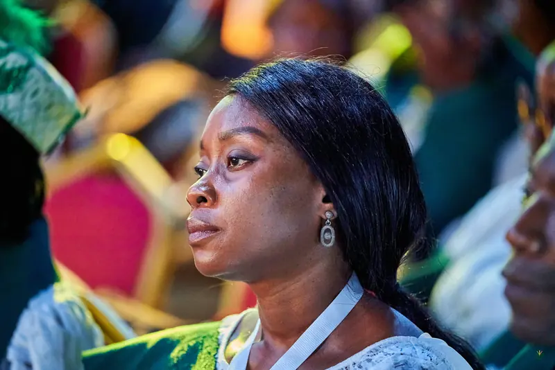 An attendee listens closely during a session