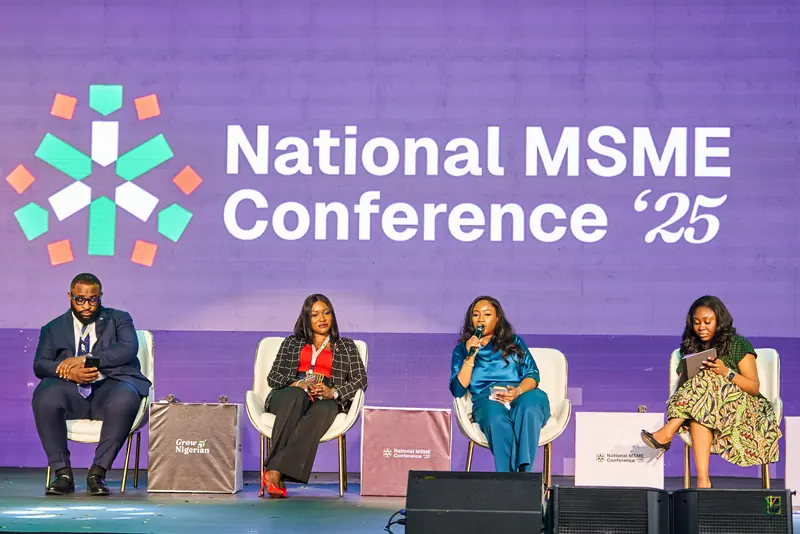 Panellists on stage under the National MSME Conference '25 screen