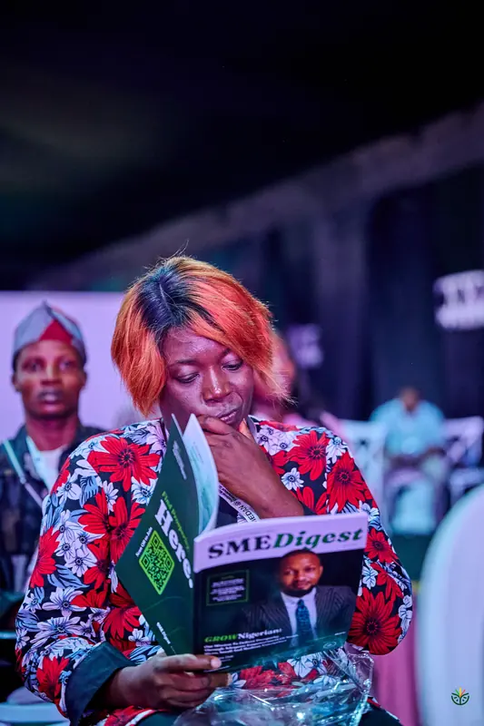 An attendee reads the SME Digest