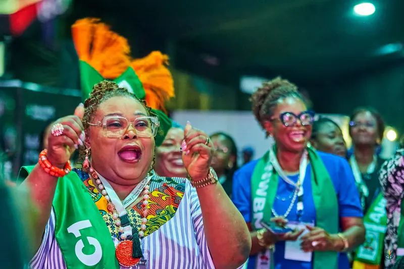 Members of the women's business network cheer from their seats