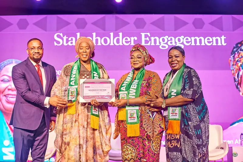 Leaders of the women's business network receive their recognition on stage